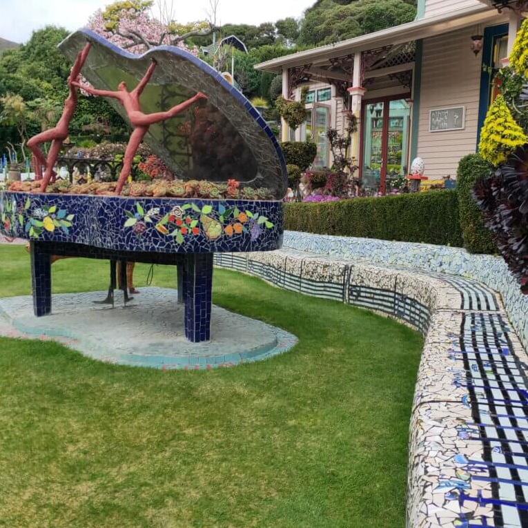 NZ-Akaroa-Giants-House-Piano-and-music-seat-1024x768